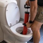 Why should you call a plumber for a clogged toilet?