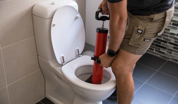 Why should you call a plumber for a clogged toilet?