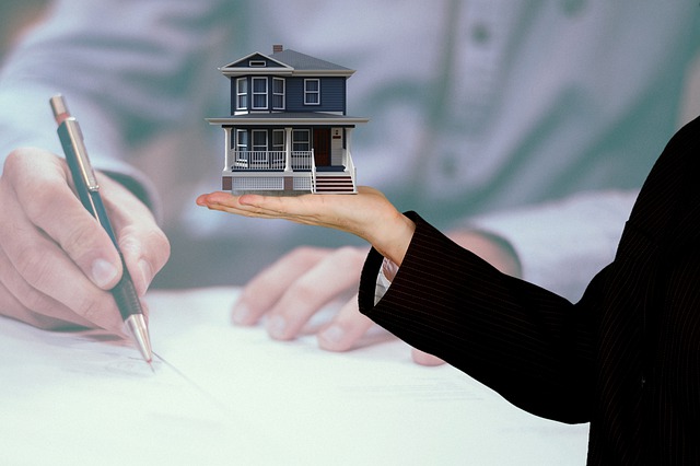 person signing a contract to buy a rental property